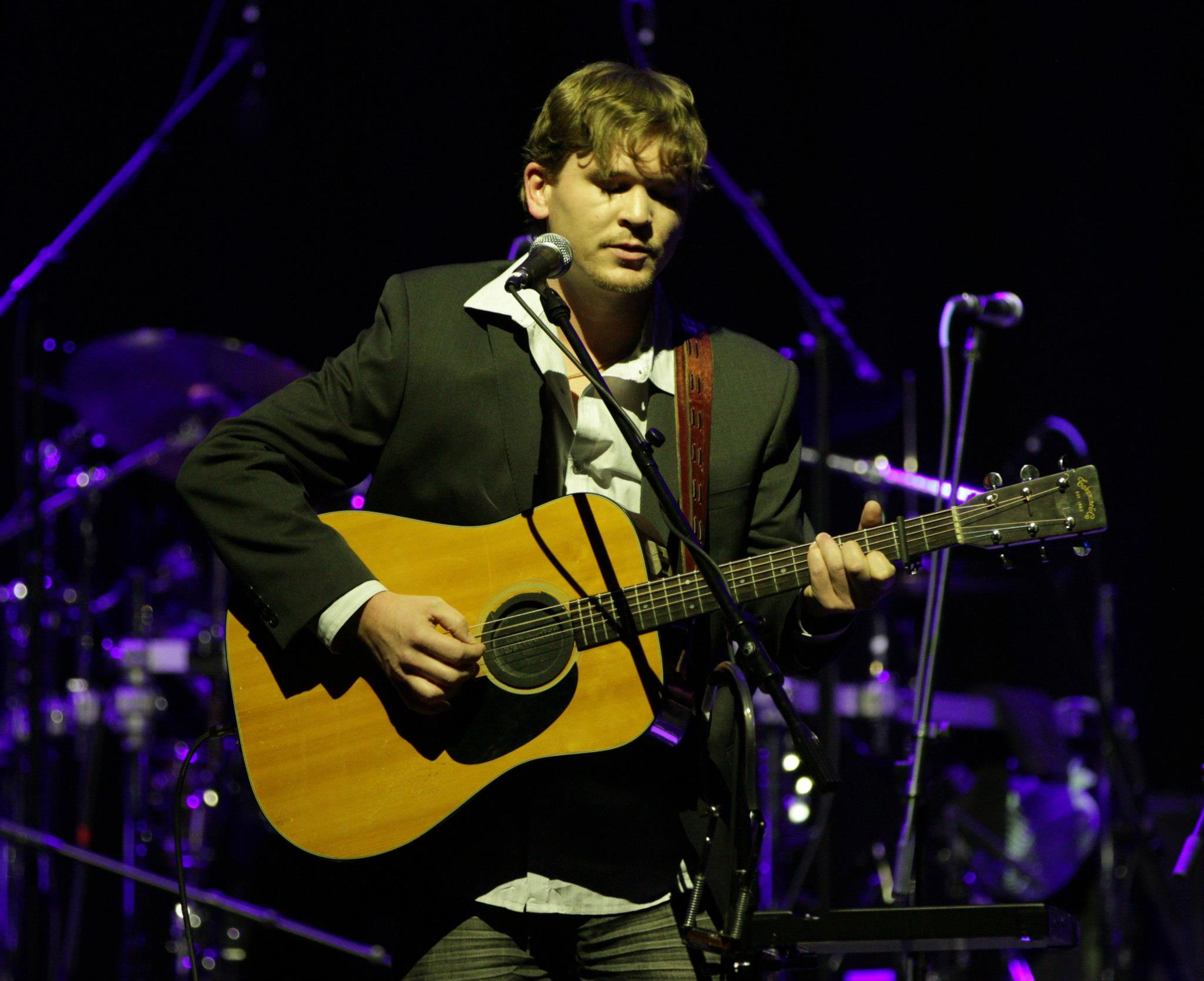 Justin Mather performing live on guitar